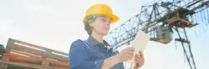 female Worker Using Tablet in Sunlight